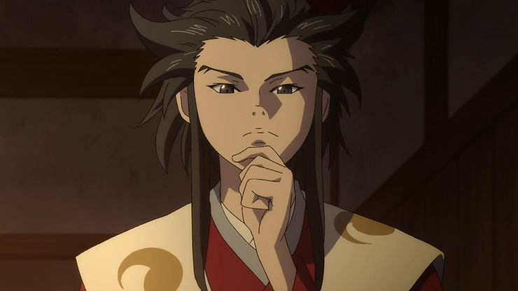 A young Japanese man holds his chin and looks deep in thought