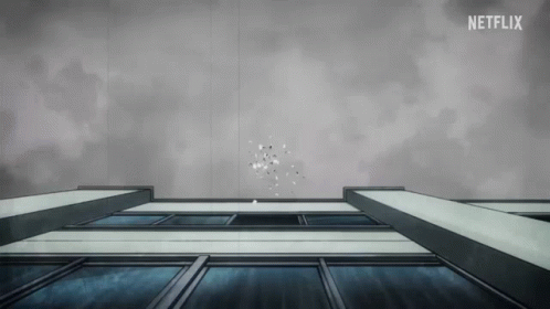 A black and white gif showing photos falling from the sky and a woman with two heads